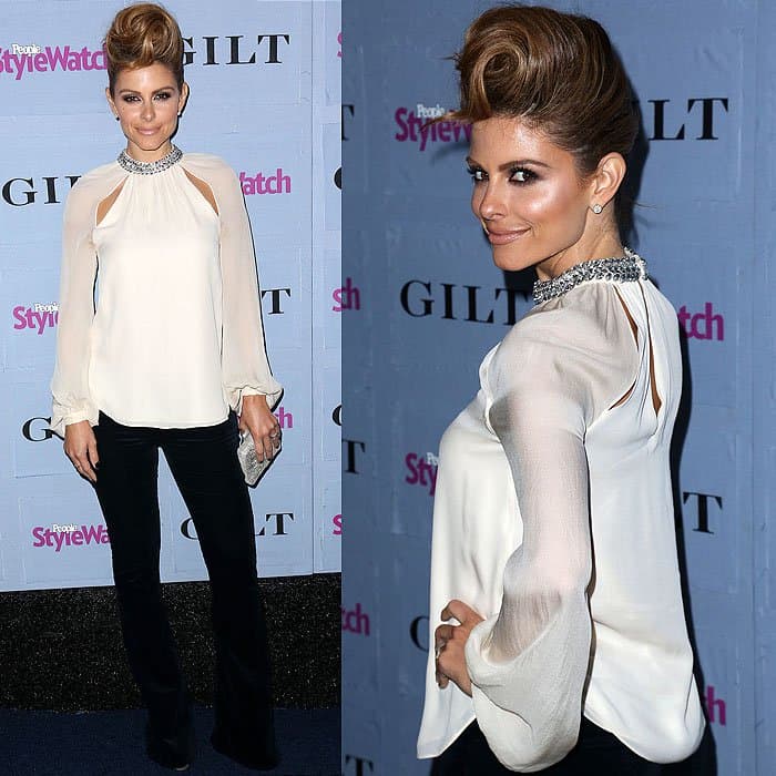 TV Personality Maria Menounos pairs an elegant embellished blouse with flared black pants, complemented by a bold beehive updo, at the People StyleWatch 3rd Annual Denim Issue Party at Palihouse on September 19, 2013, in West Hollywood, California