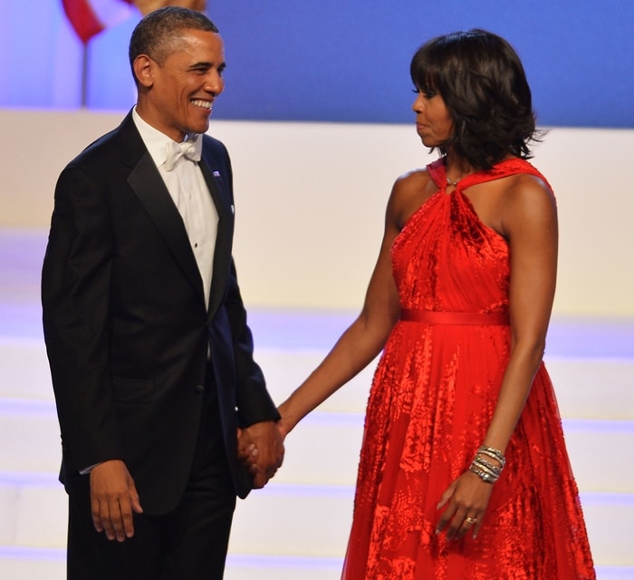 First Lady Michelle Obama wore a striking red halter dress by Jason Wu and accessorized with Kimberly McDonald jewelry at her second inaugural ball in 2013