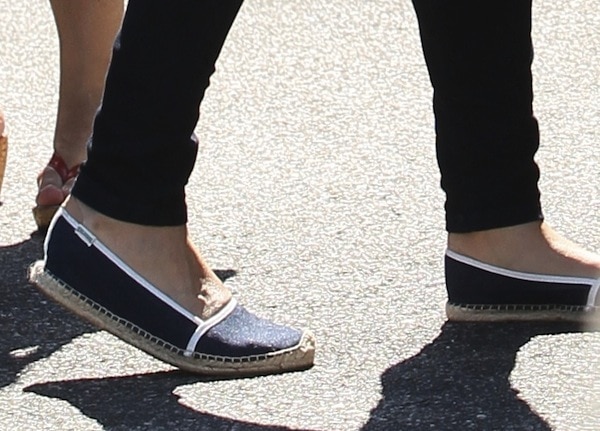 Mila Kunis completes her casual ensemble with stylish denim canvas shoes, perfect for a day out
