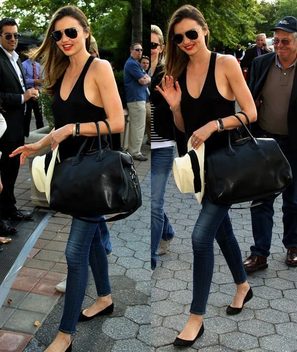 Miranda Kerr sported a casual outfit consisting of a black tank top, a black Givenchy handbag, and blue skinny jeans from Frame Denim