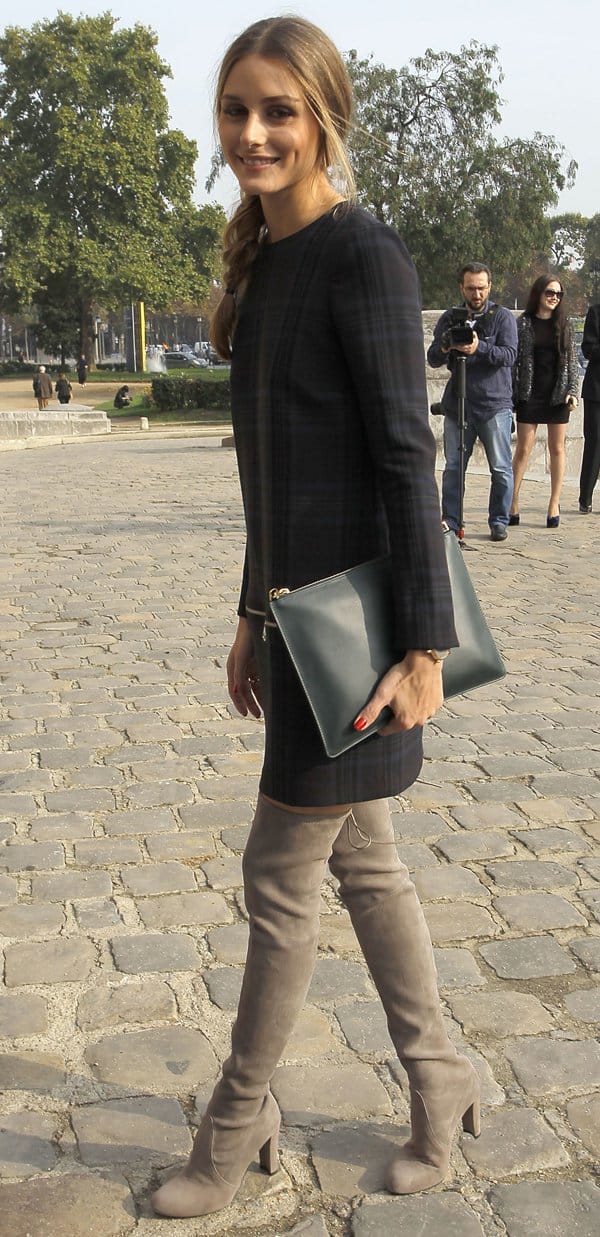 Olivia Palermo rocked boots with a plaid Zara zippered mini dress