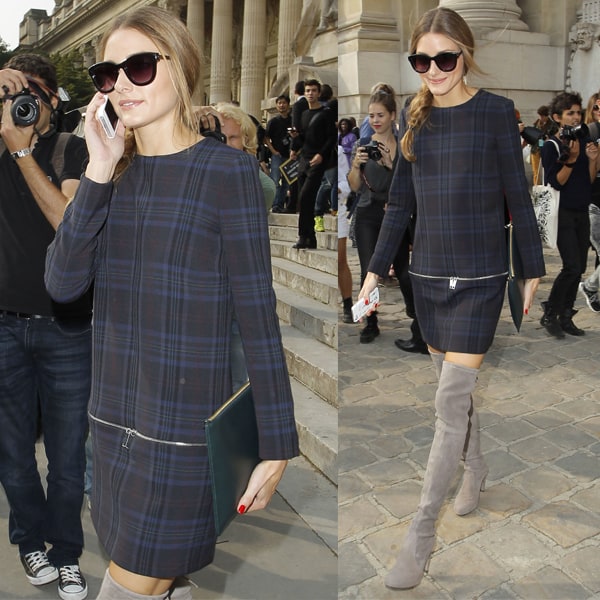 Olivia Palermo pretending to talk on the phone at Paris Fashion Week