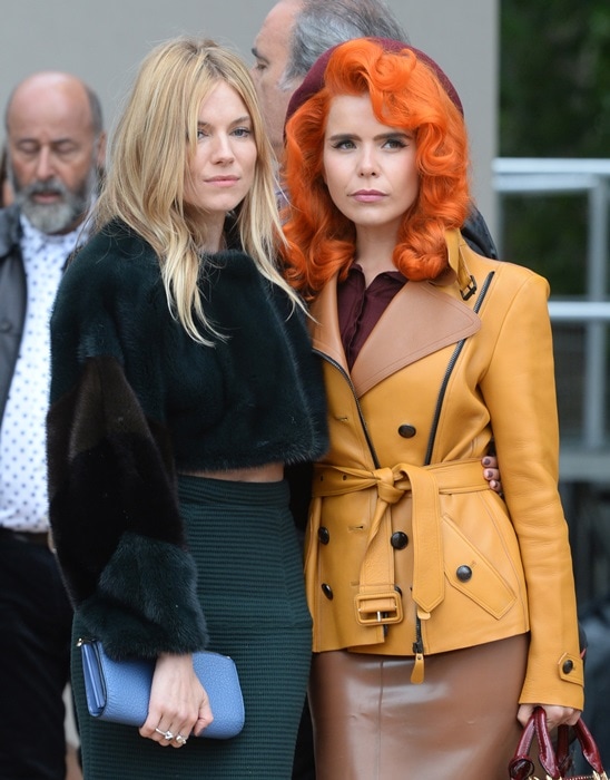 Talk about contrasts, here's Paloma's bright ensemble versus Sienna Miller's cropped fur top and striped skirt