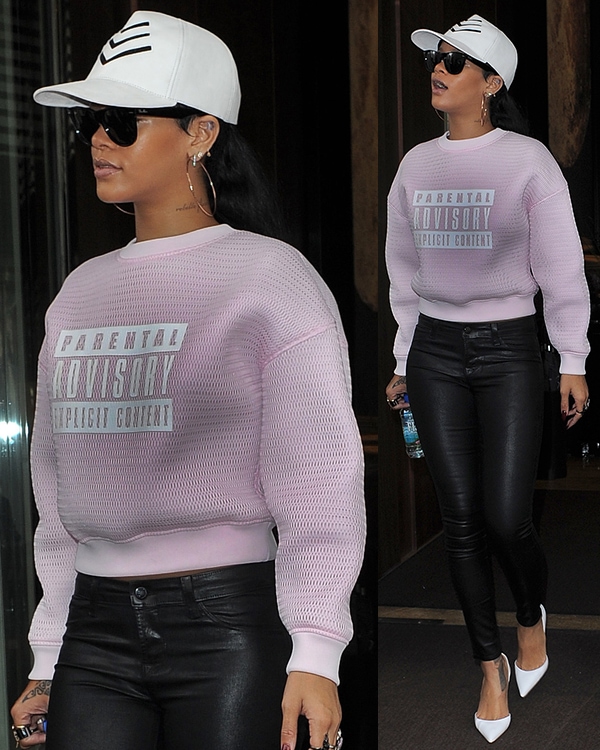 Rihanna steps out in London wearing an Alexander Wang "Parental Advisory" sweatshirt, black leather pants, and sleek white Manolo Blahnik pumps in London to film a talk show appearance