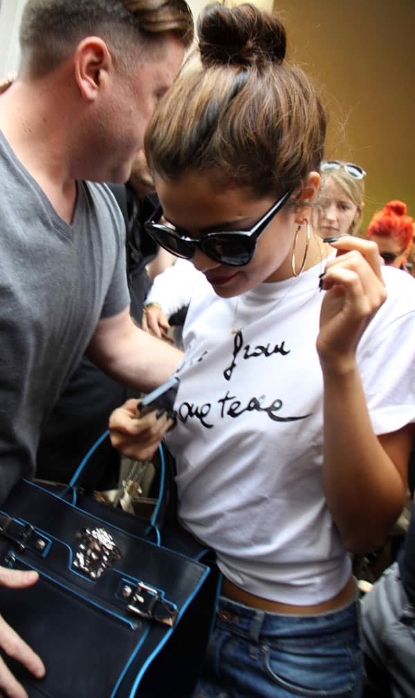 Selena Gomez leaving Versace in a very-appropriate Versace Love from Donatella T-shirt
