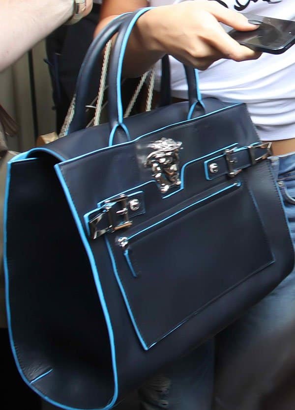 Selena Gomez toting a Versace handbag