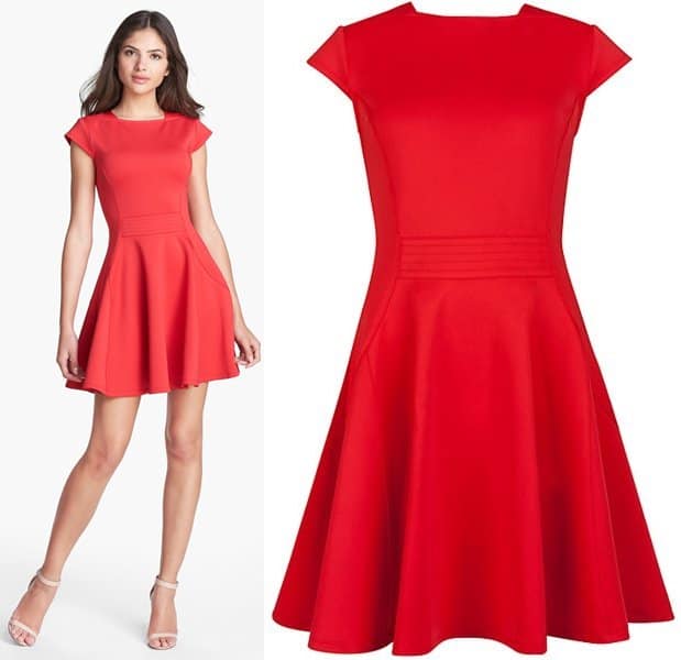 A high square neckline, topstitched waist panels and full, swingy fit captivate the eye and focus attention on a lustrous red scuba-knit dress