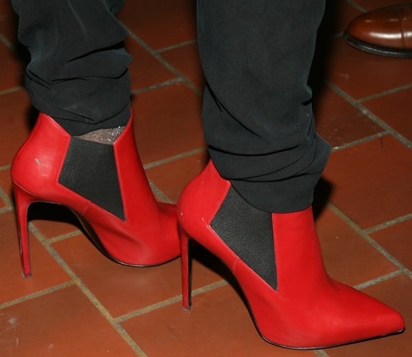 Catherine Malandrino wearing a pair of red booties for her spring 2014 presentation