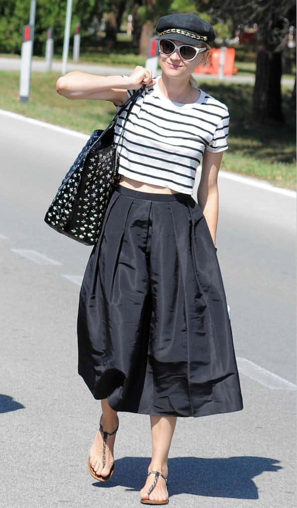Diane Kruger donned a striking black and white outfit, featuring a striped cropped top paired with a midi full skirt by Tibi