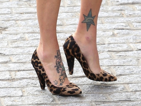 Striking a Pose: Fearne Cotton kicks off London Fashion Week by showing off her tattoos in eye-catching leopard-print heels
