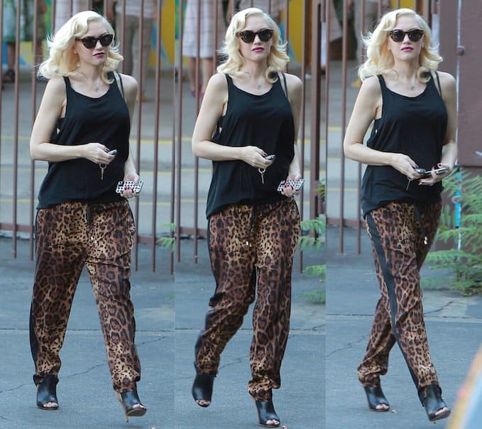 Gwen Stefani rocking a loose black tank and leopard-print lounge pants, which have fueled speculation about a possible baby bump