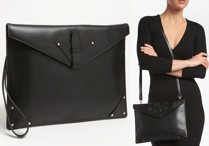 Metallic stud details add a sophisticated touch to a slim envelope clutch fashioned from rich, burnished leather