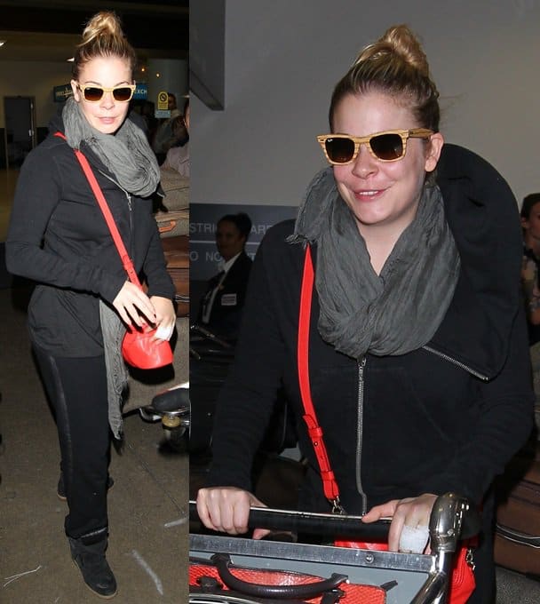 LeAnn Rimes wears bamboo-framed sunglasses and totes a red micro Givenchy Nightingale purse