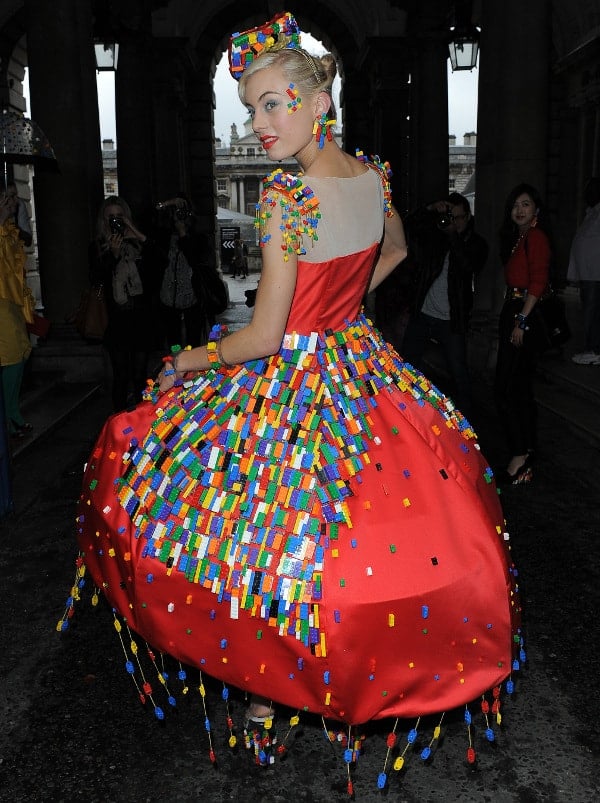 Cochevelou treated the bricks like Swarovski crystals or rhinestones, using them as embellishments on the skirt, clustering them about the shoulders, lining them on the bodice, and dangling them in tassels from the hem