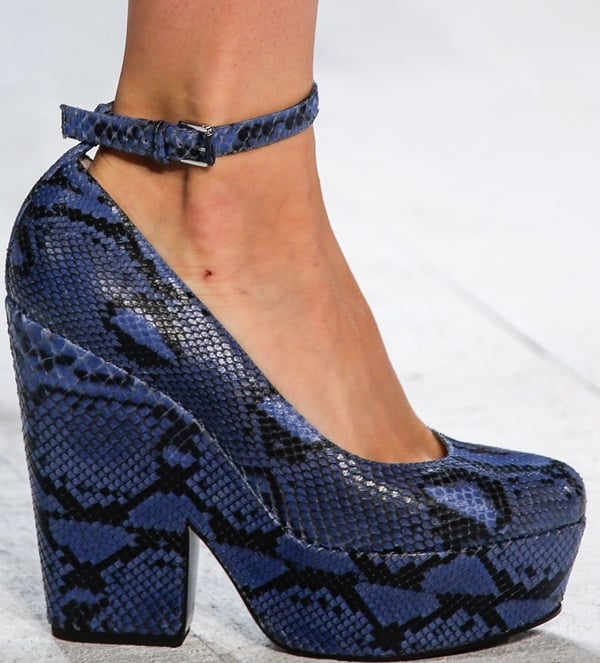 Blue snakeskin-textured platform pump with an ankle strap and chunky block heel