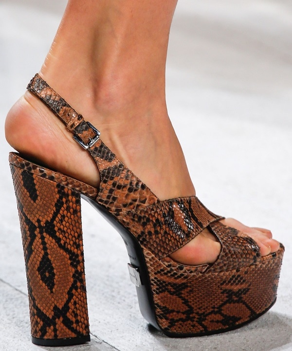 Brown snakeskin-patterned platform sandal with wide straps and a towering block heel
