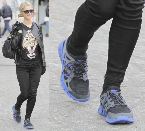 Paris Hilton wears blue and grey Nike running shoes