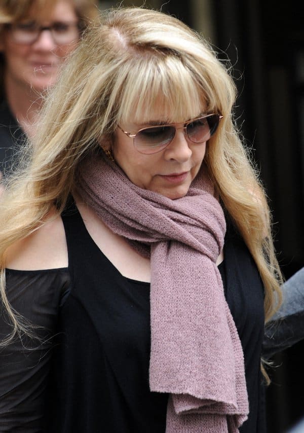 Stevie Nicks rocks a rose pink scarf over modern threads