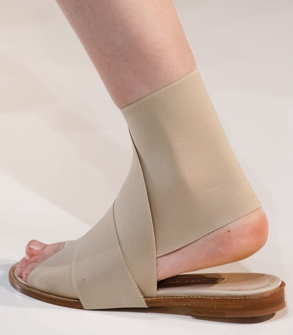 The always sleek and minimal Victoria Beckham sticking to her style aesthetic with pointy mules and clean fuss-free bandage sandals for Spring 2014 