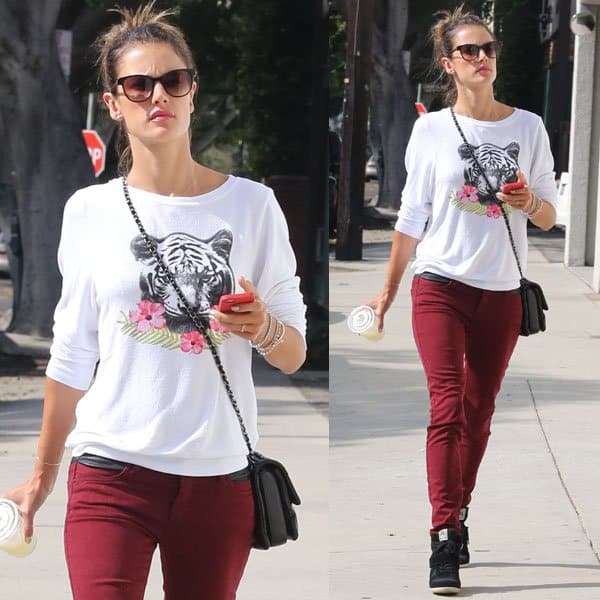 Alessandra Ambrosio in a tiger-print top and red jeans