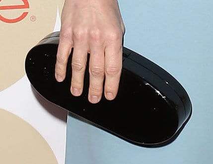 Anna Faris holding a sleek black clutch from Edie Parker at the People Magazine's "Ones to Watch" party