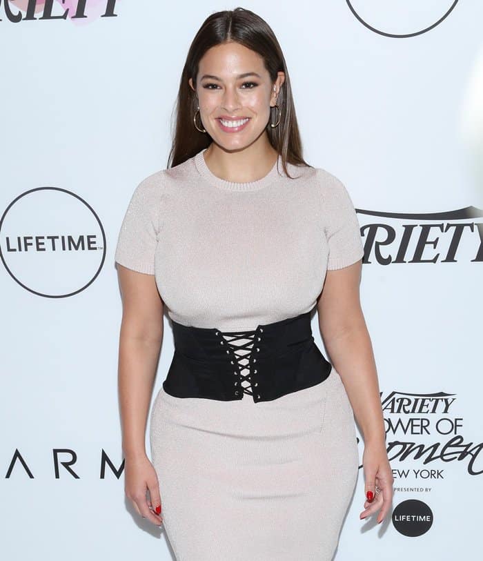 Ashley Graham shows off her small waist in a wide belt that looked like a modern corset.