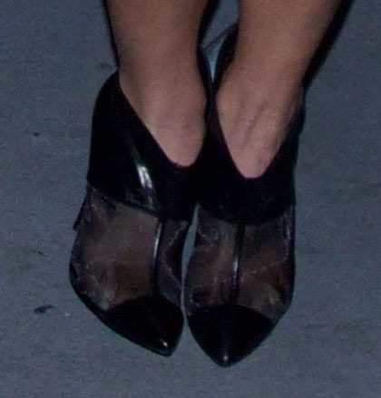 Ashley Greene steps out in edgy black pointed-toe heels featuring sheer mesh panels and glossy leather accents