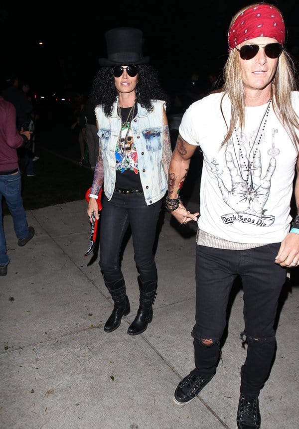 Cindy Crawford alongside Rande Gerber, channeling rock legends at Mike Meldman's Halloween bash in Beverly Hills, October 26, 2013