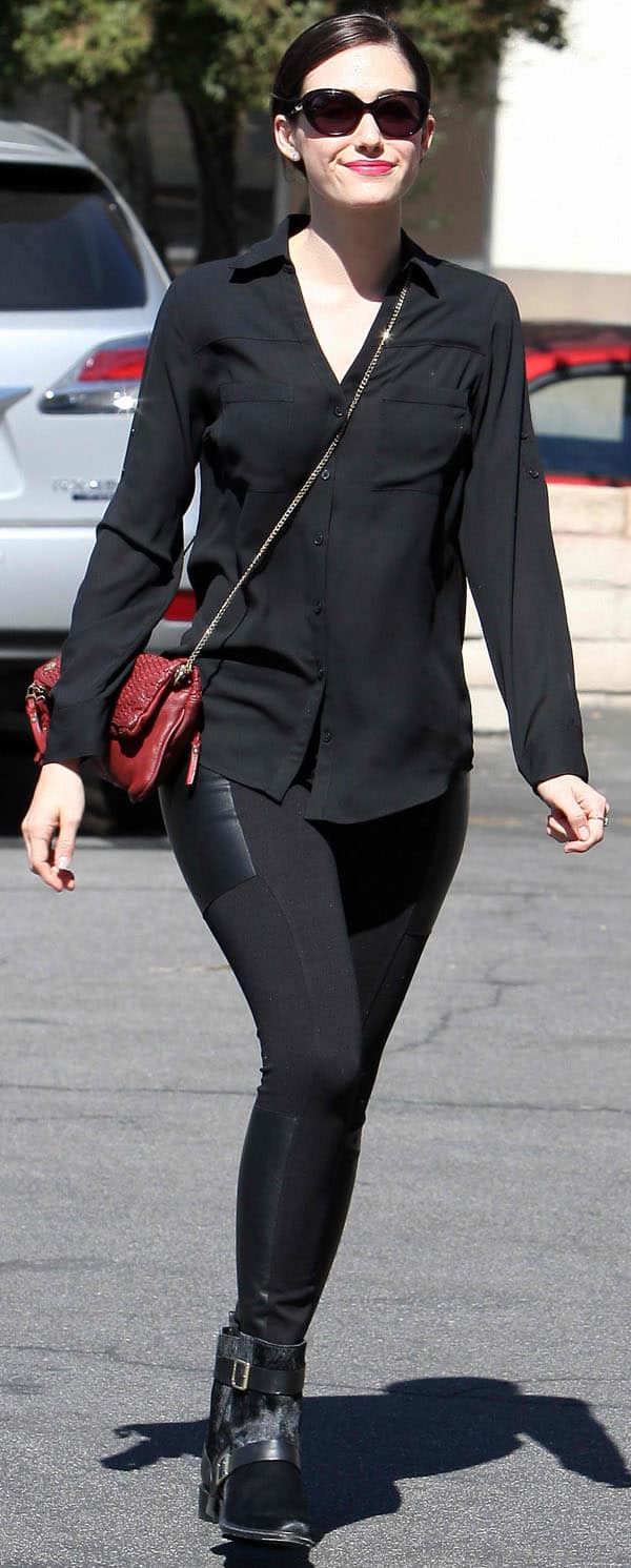 On October 8, 2013, Emmy Rossum was spotted in Los Angeles wearing Twenty Tees ponte leggings with leather patches in black, a Zadig & Voltaire Rock Tresse pochette, and Rachel Zoe Terri booties