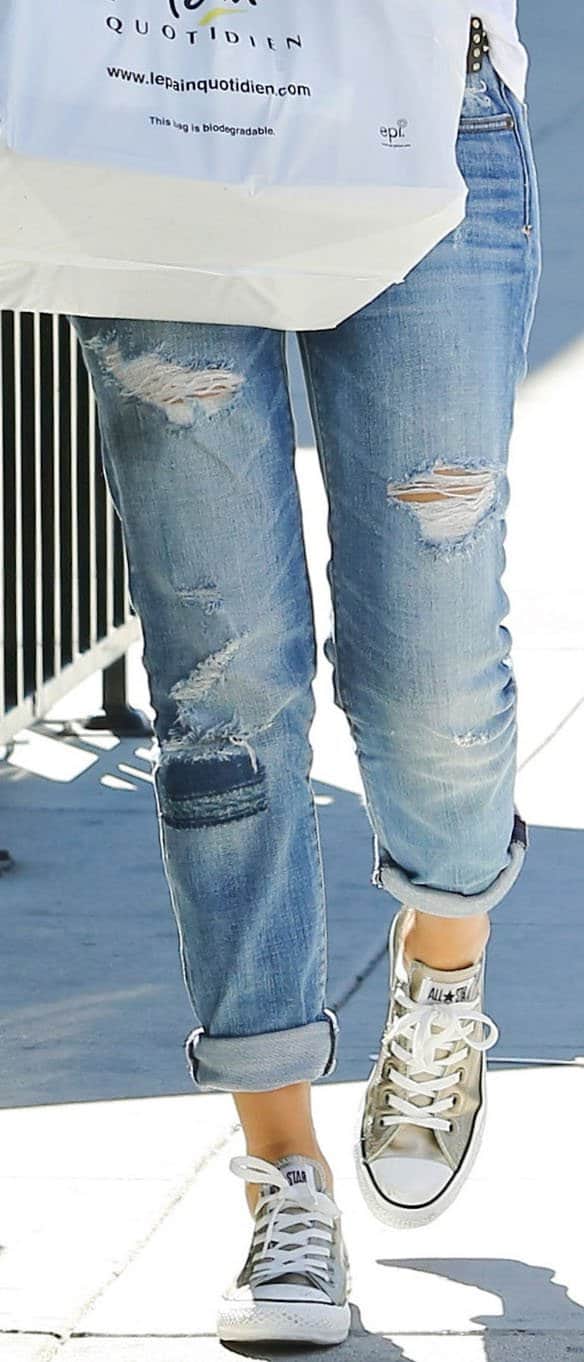 Jessica Alba in her staple white shirt and youthful chucks to complete her college girl look
