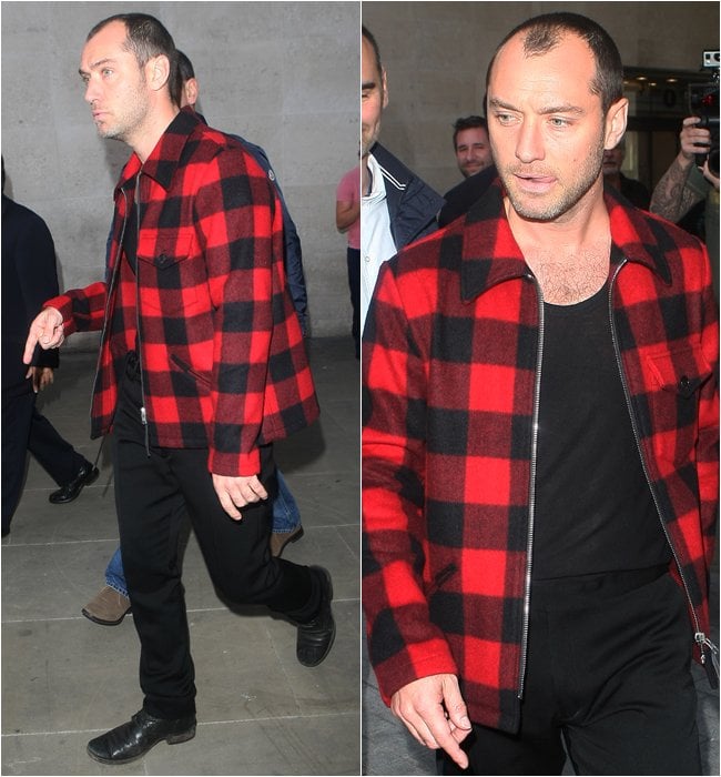 Jude Law sported the tartan trend while posing and signing autographs for his fans