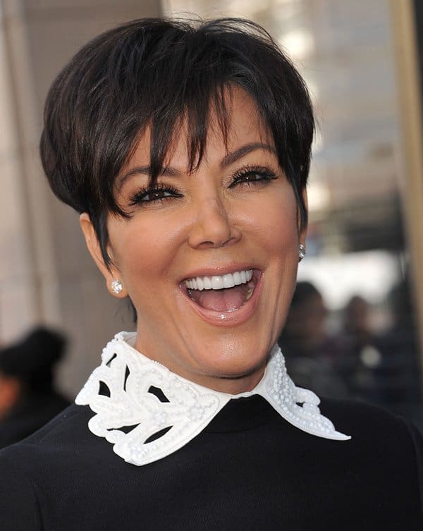 Kris Jenner stuns in a chic black and white Valentino dress, reminiscent of a glamorous pilgrim look