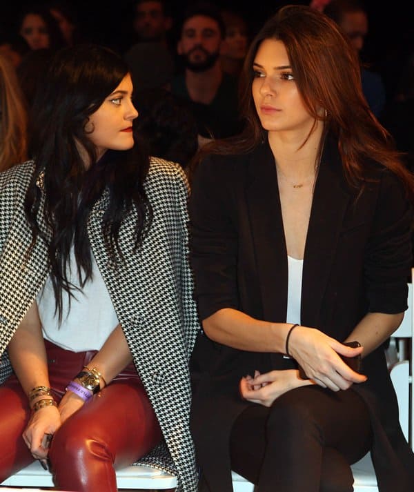Kylie Jenner with sister Kendall at the Day by Day fashion show in Los Angeles on October 16, 2013