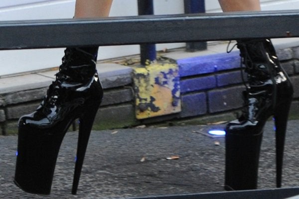 Lady Gaga wears a pair of towering PVC boots on her feet