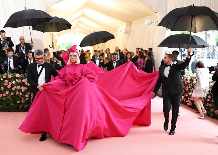 Lady Gaga wearing a giant pink dress by Brandon Maxwell at the 2019 Met Gala Celebrating Camp: Notes on Fashion