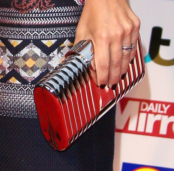 Louise Redknapp accessorizing her metallic dress with a silver clutch at the Pride of Britain Awards