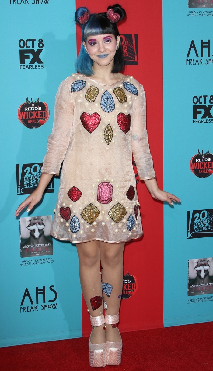 Melanie Martinez with her signature royal blue and black hair attending the fourth season premiere of her hit show American Horror Story: Freak Show