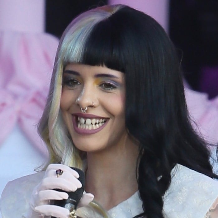 Melanie Martinez confidently flaunted her unique dental feature - a noticeable gap between her teeth, adding to her distinct charm and individuality