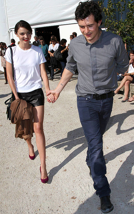 Miranda Kerr and Orlando Bloom leave the Christian Dior spring/summer 2012 fashion presentation at Paris Fashion Week