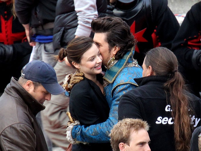 Miranda Kerr and Orlando Bloom embrace on the set of The Three Musketeers at Residenz Wuerzburg