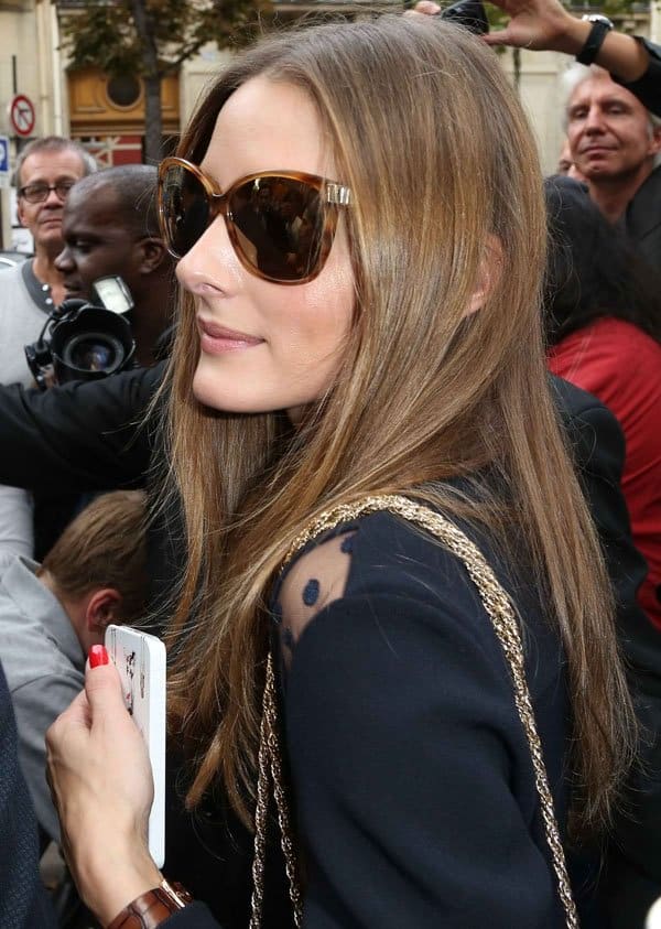 Olivia Palermo in a sheer dot-panel blouse arriving at the Paris Fashion Week Ready-to-Wear Spring/Summer 2014