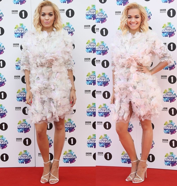 Rita Ora flaunts her legs in a frilly embellished dress from the Marchesa Spring 2014 collection