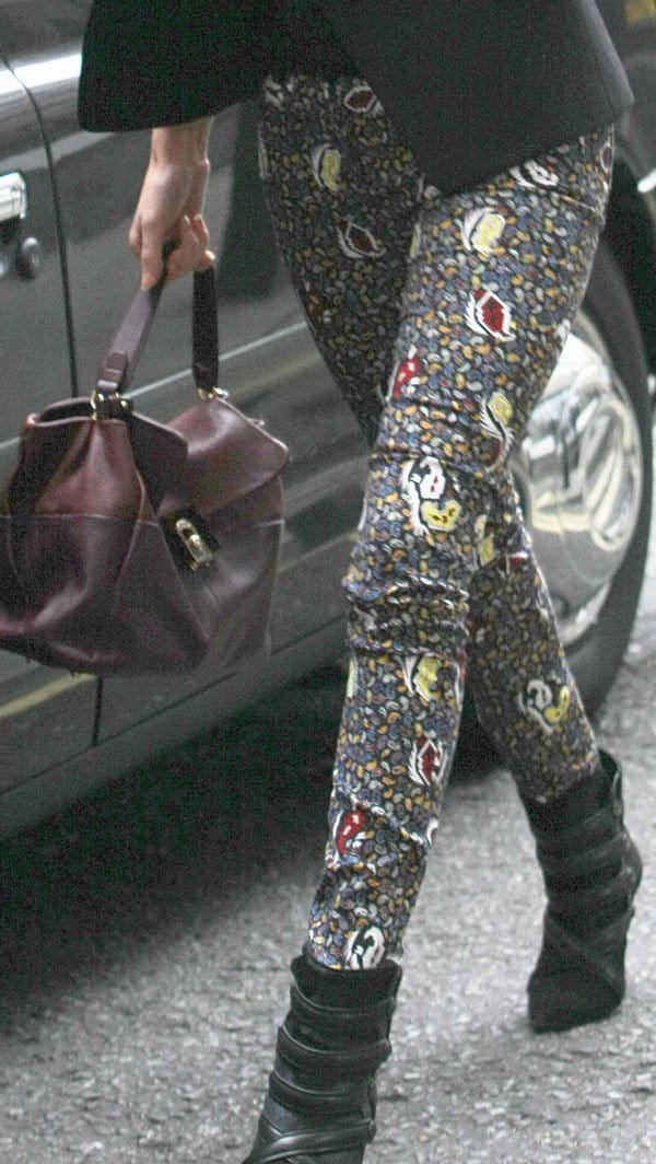 Rosie Huntington-Whiteley walking in Balenciaga paisley-pattern skinny jeans, carrying a Lanvin "For Me" tote, and wearing Étoile Isabel Marant 'Tacy' low boots