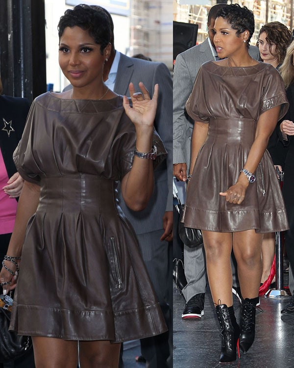 Toni Braxton showing off her sexy legs in a leather sheath dress that accentuated her well-defined waist