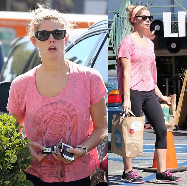 Ashley Greene runs errands in West Hollywood while wearing a pink tee and a pink head wrap with her workout leggings on September 30, 2013