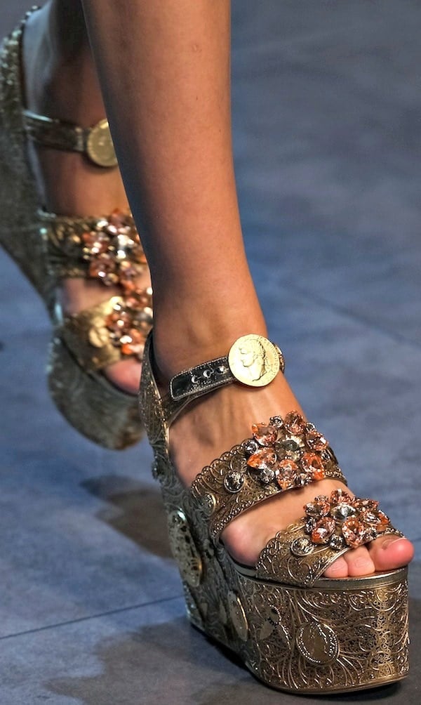 Gold Dolce & Gabbana wedge sandals with intricate floral embellishments and gold coin details