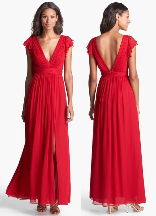 Double-layer flutter sleeves frame the plunging V-neckline on a striking chiffon dress that tumbles from the inset waist into a full and flowy skirt with a breezy, front-slit finish