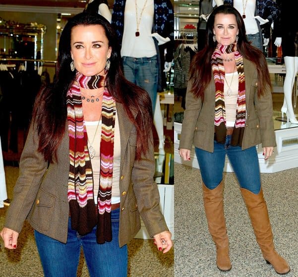 Kyle Richards smiles and poses for photographers as she arrives at her Kyle by Alene Too boutique in Beverly Hills on October 8, 2013