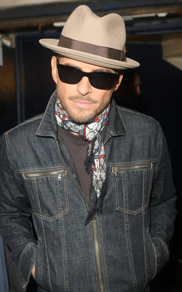 Matt Goss spotted leaving Cafe de Paris in London, showcasing his stylish fedora and choker scarf on October 9, 2013
