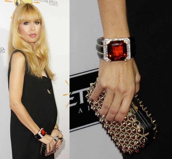 Rachel Zoe accentuated her all-black look with a dramatic red cuff she wore on her right wrist